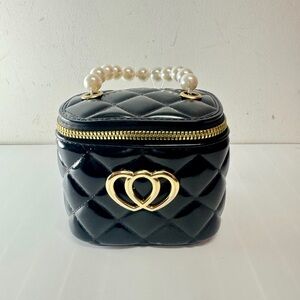 Elegant Black Quilted Handbag with Gold Accents